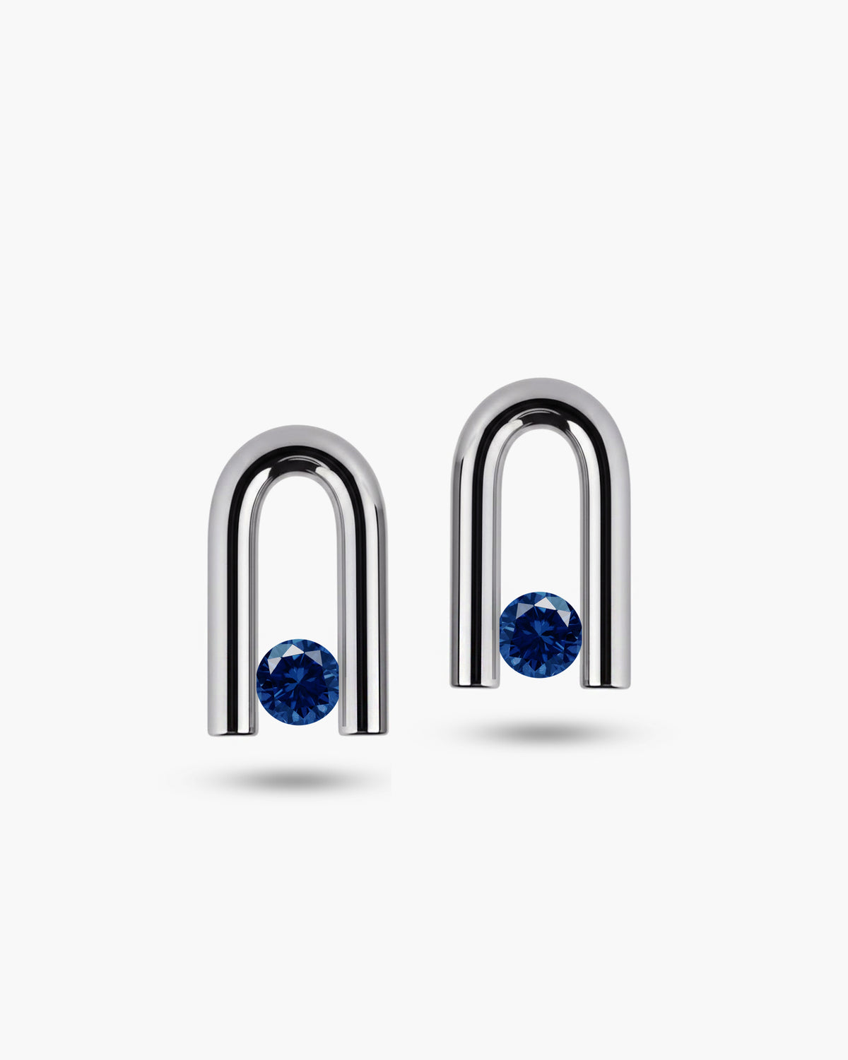 taormina-nexus-stud-earrings-tension-set-blue-sapphire-front