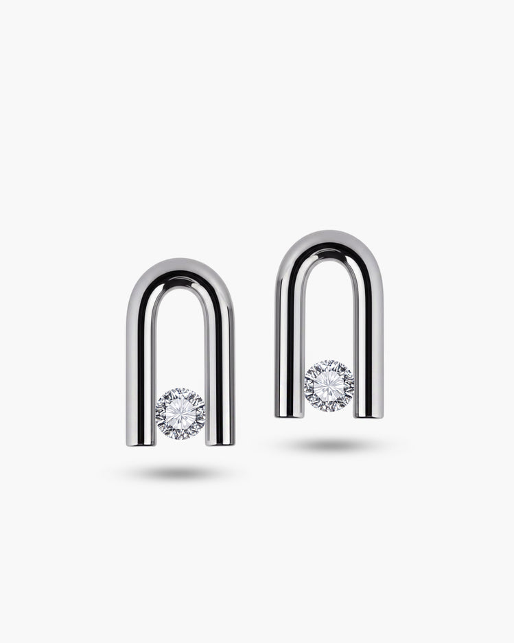 taormina-nexus-stud-earrings-tension-set-white-sapphire-front