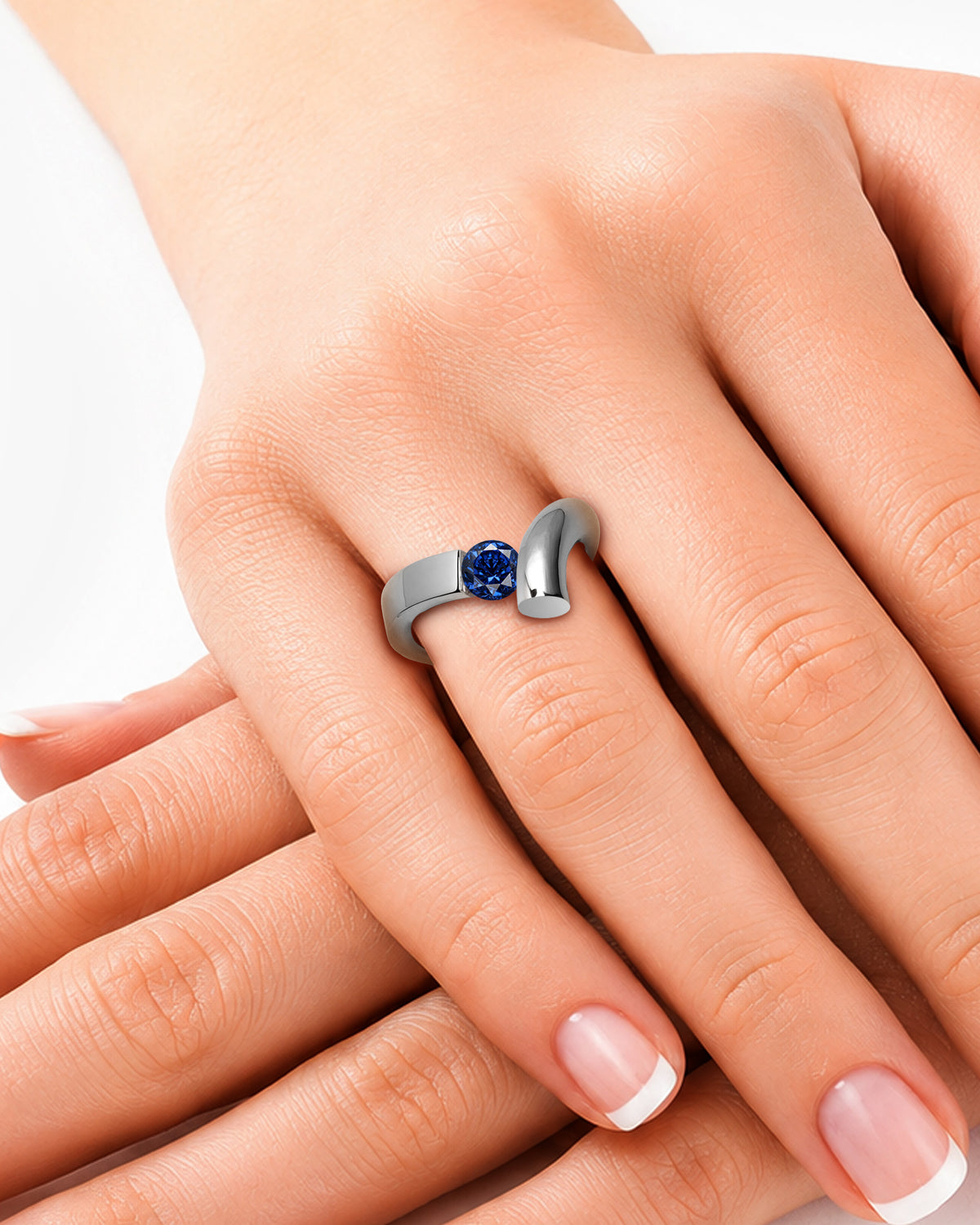 taormina-profilo-tension-set-ring-blue-sapphire-model-hand